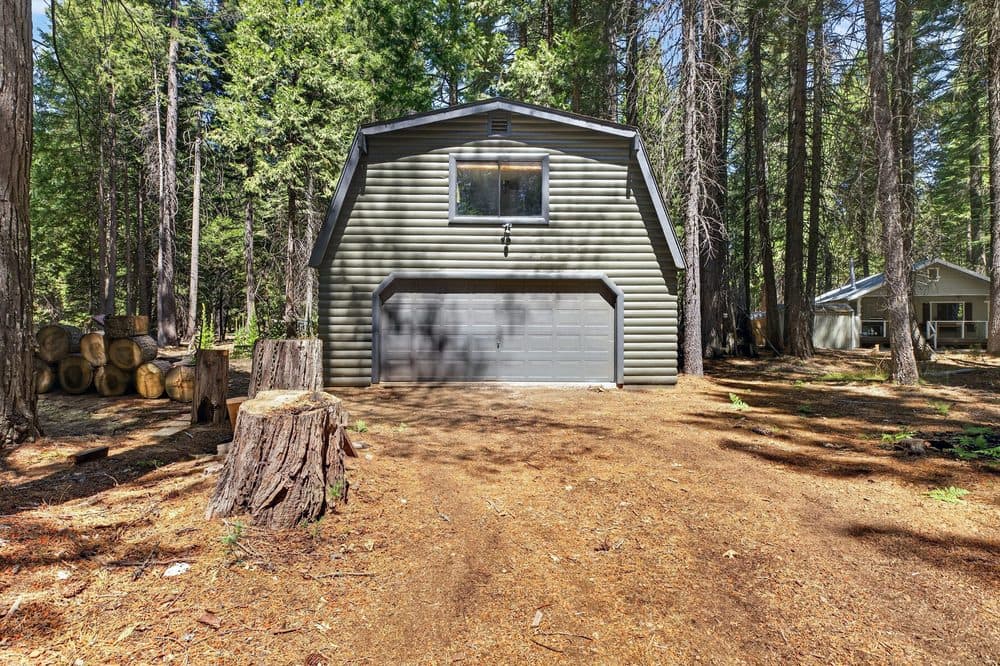 Outbuilding under tall pines on a Thatcher Mill Road property
