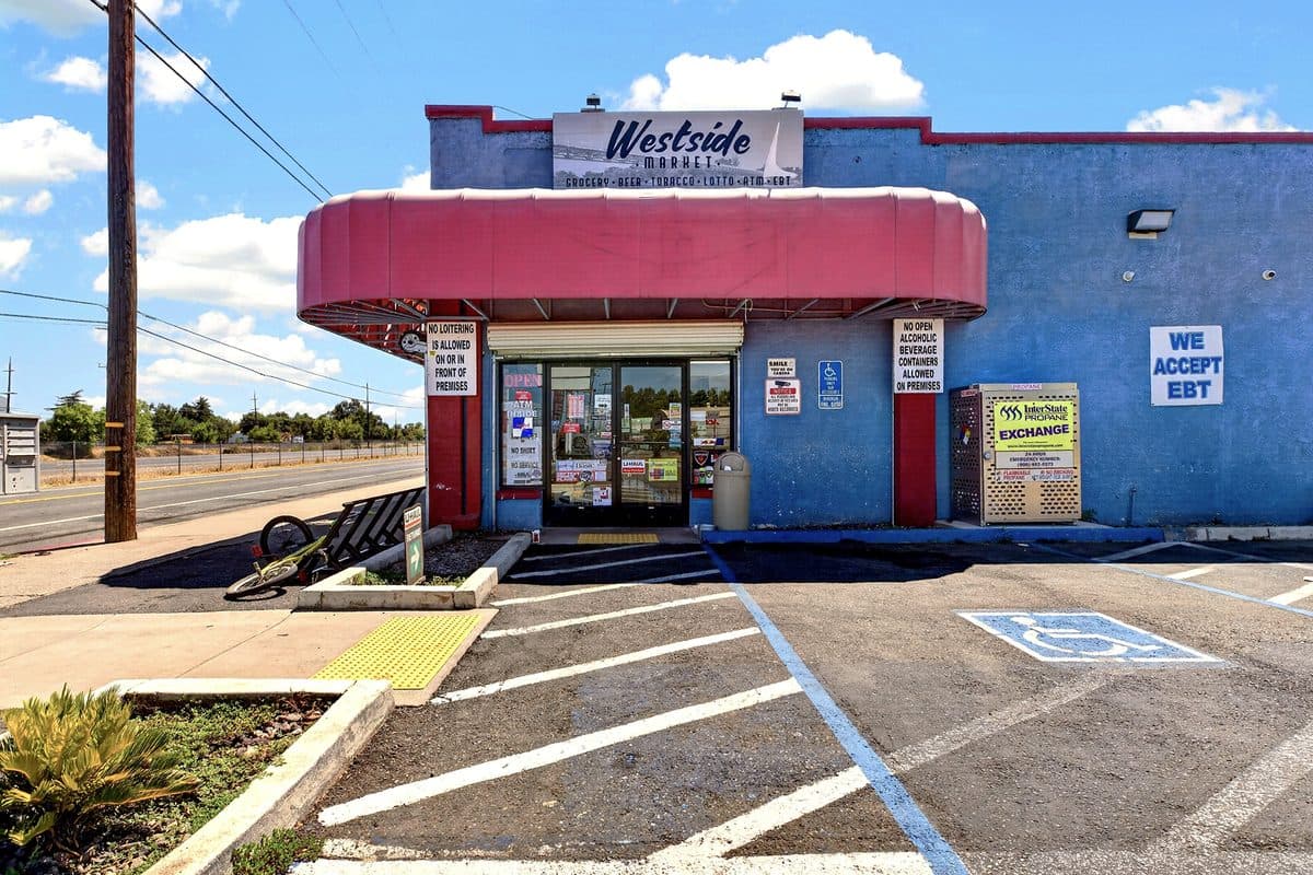 Storefront of a commercial market building on Westside Road in Redding